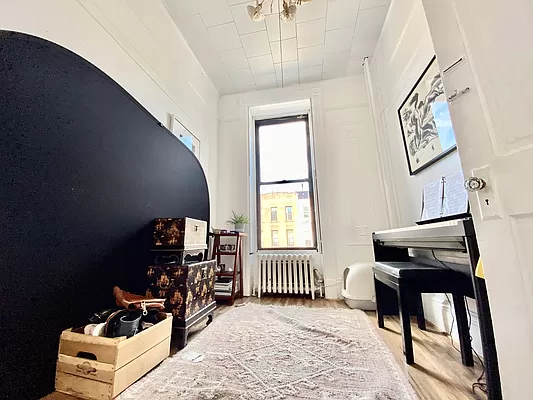 351 7th Avenue, Unit 2 Brooklyn, NY 11215 - Photo 9 of 10 a bedroom with furniture and a window