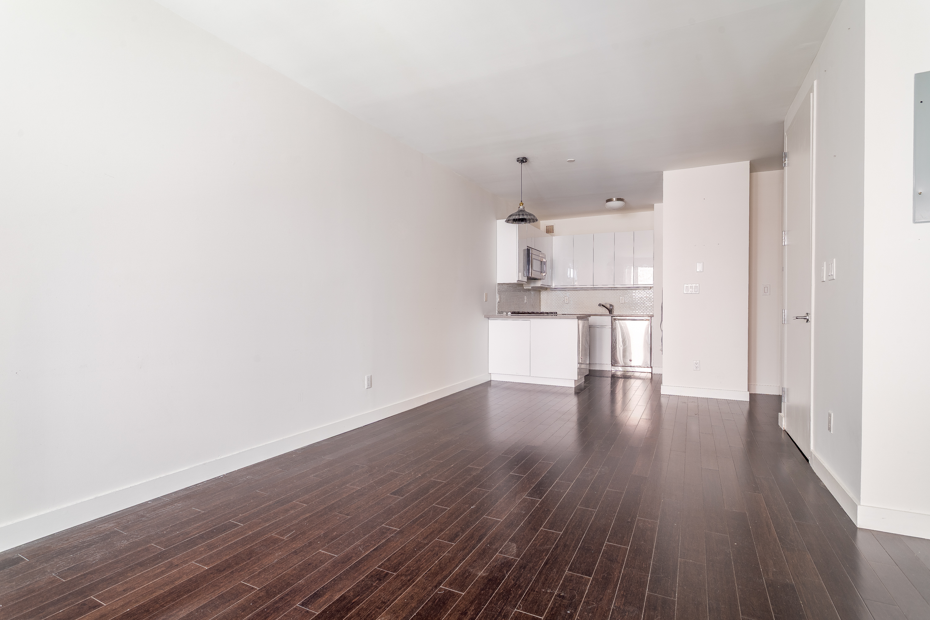 753 St Nicholas Avenue, Unit 2B Manhattan, NY 10031 - Photo 4 of 10 a view of kitchen with wooden floor
