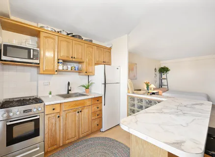 a living room with a large window and a table