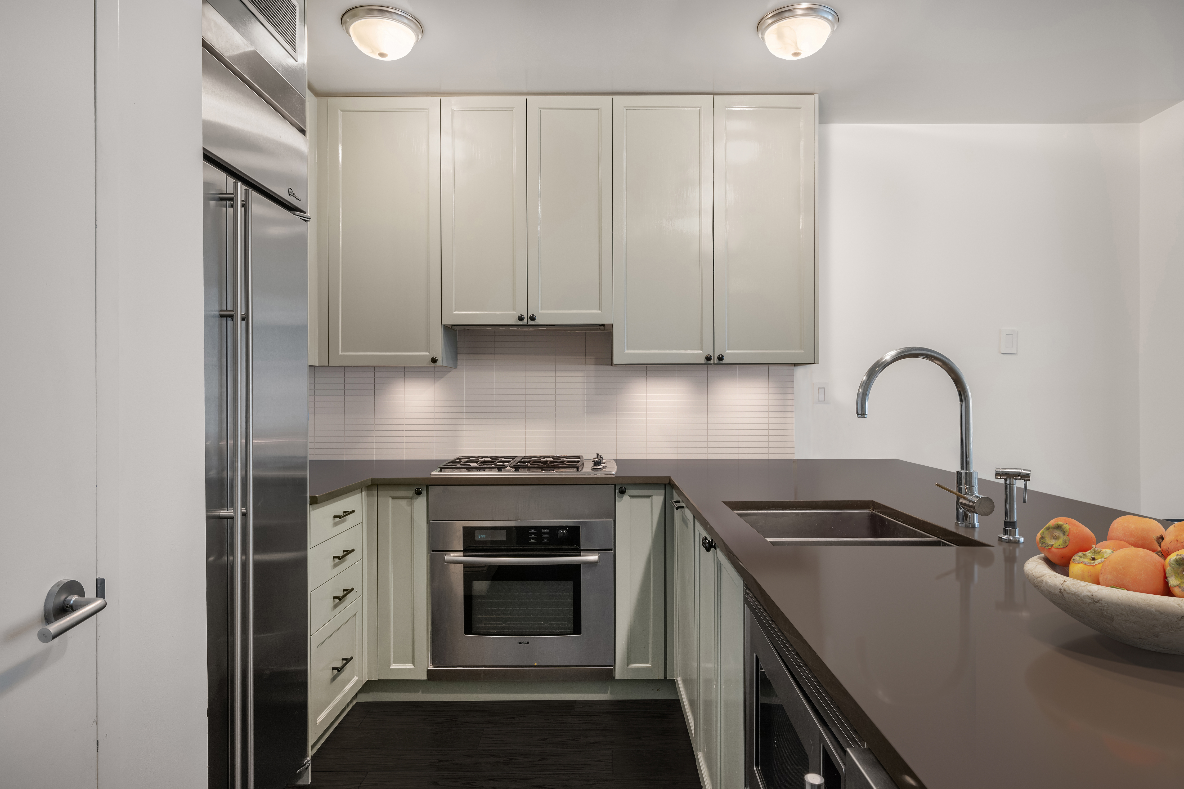 125 West 22nd Street, Unit 8B Manhattan, NY 10011 - Photo 3 of 10 a view of a kitchen with sink stove and refrigerator