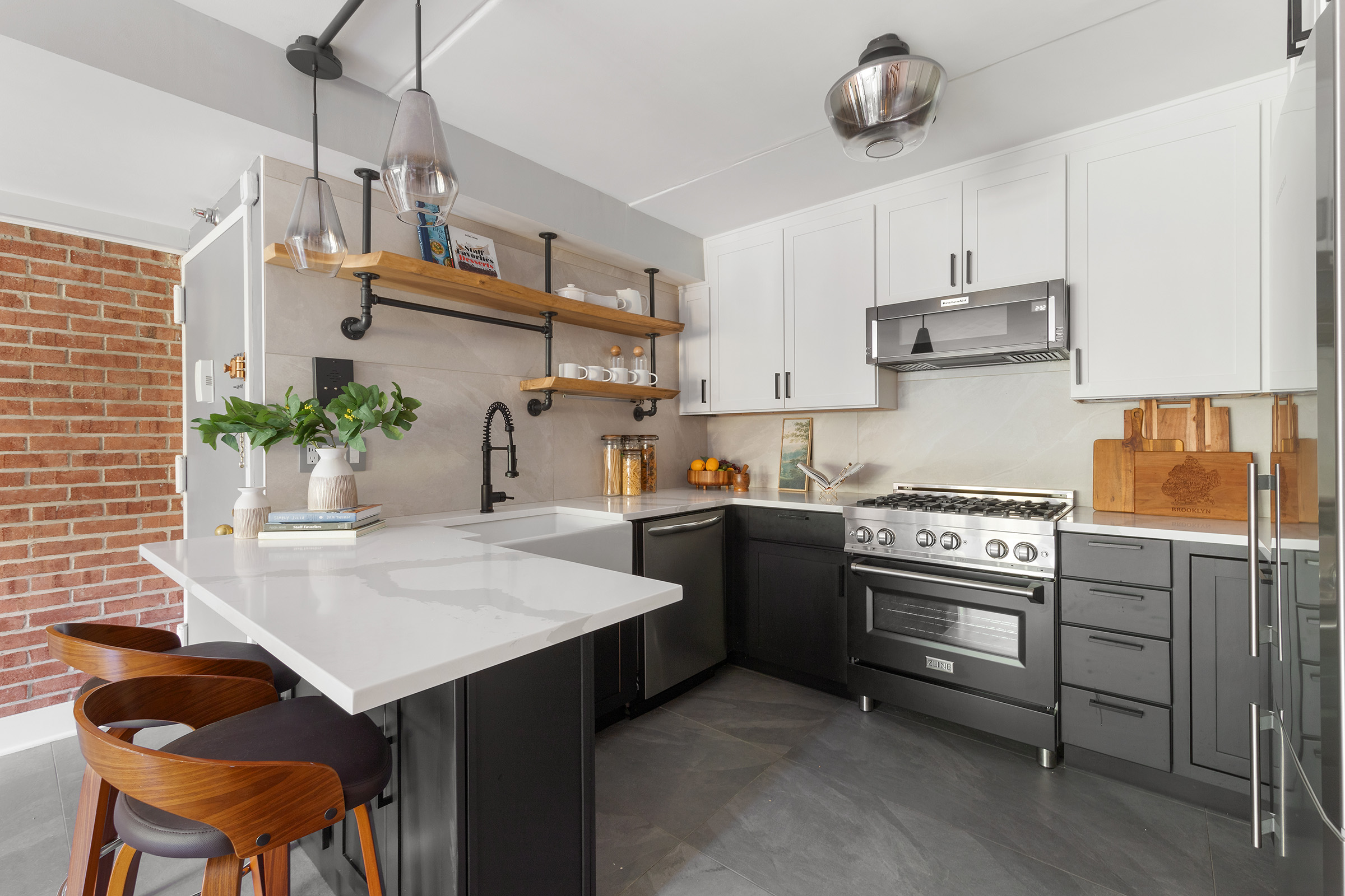 113 Prospect Park Southwest, Unit 12 Brooklyn, NY 11218 - Photo 2 of 13 a kitchen with a table and chairs in it