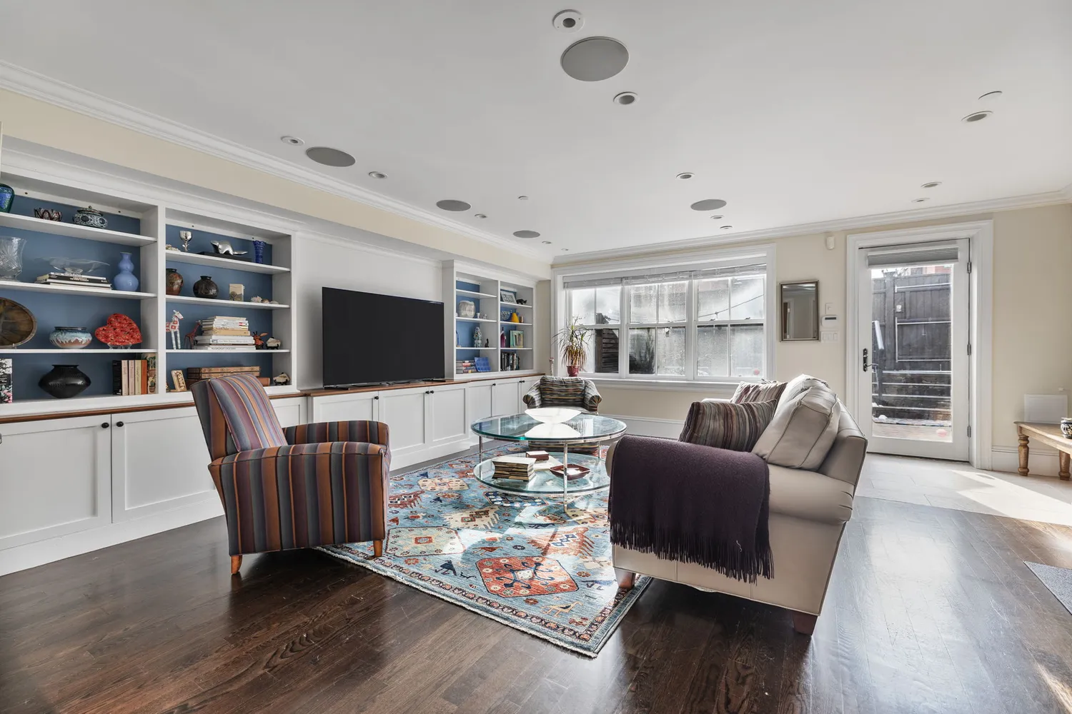 a living room with furniture fireplace and a flat screen tv