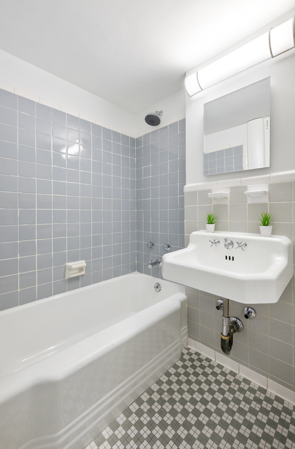 35-51 85th Street, Unit 4K Queens, NY 11372 - Photo 10 of 11 a bathroom with a sink a toilet and shower