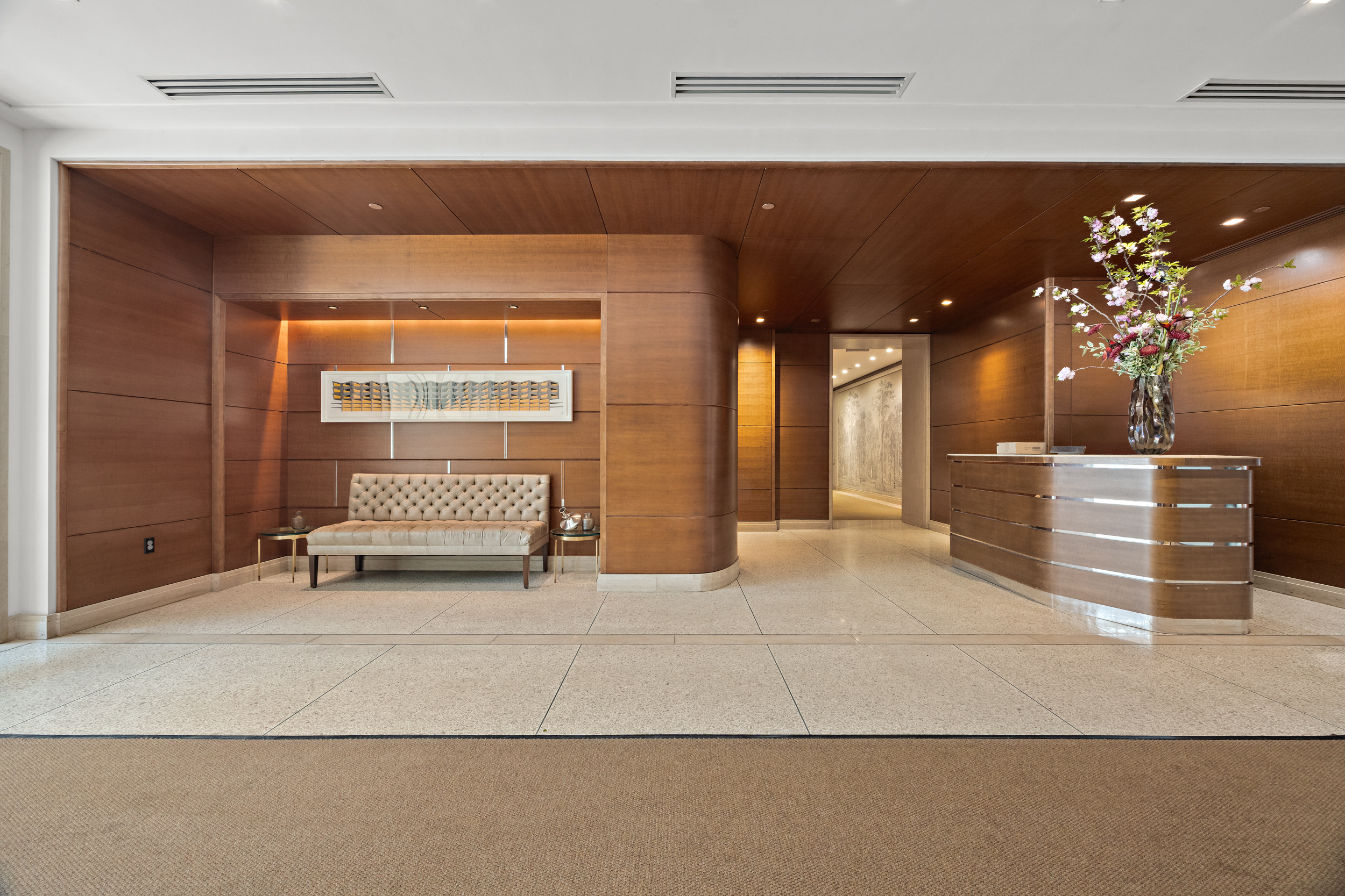 177 9th Avenue, Unit 3K Manhattan, NY 10011 - Photo 13 of 14 a view of a hallway with a couch and chandelier