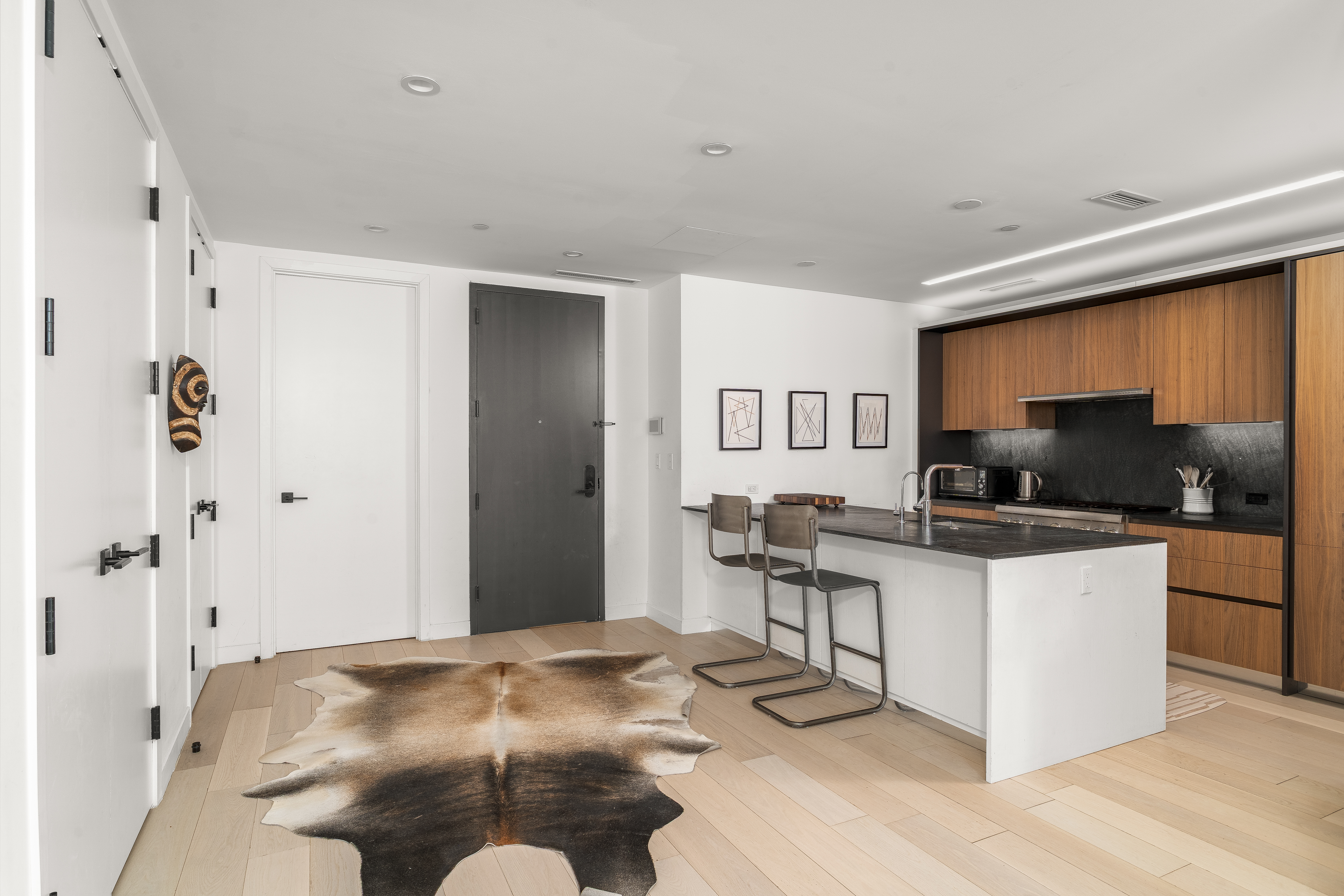 856 Washington Avenue, Unit 5A Brooklyn, NY 11238 - Photo 3 of 19 a kitchen with stainless steel appliances kitchen island granite countertop a refrigerator and a stove top oven