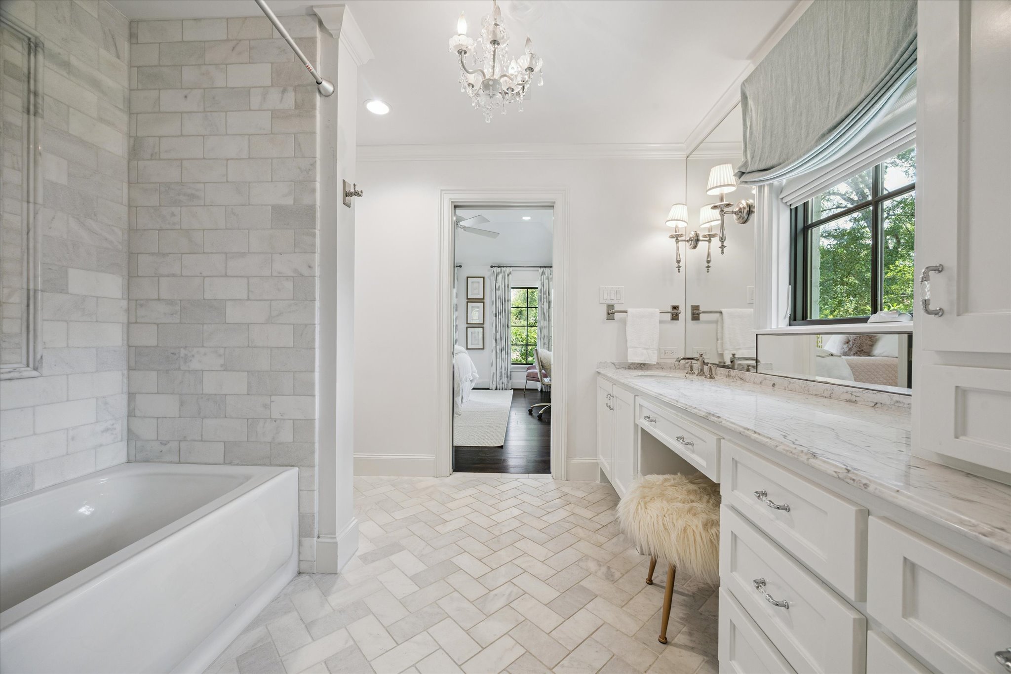 310 Longwoods Lane Houston, TX 77024 - Photo 33 of 49 a spacious bathroom with a granite countertop sink a mirror and a bathtub