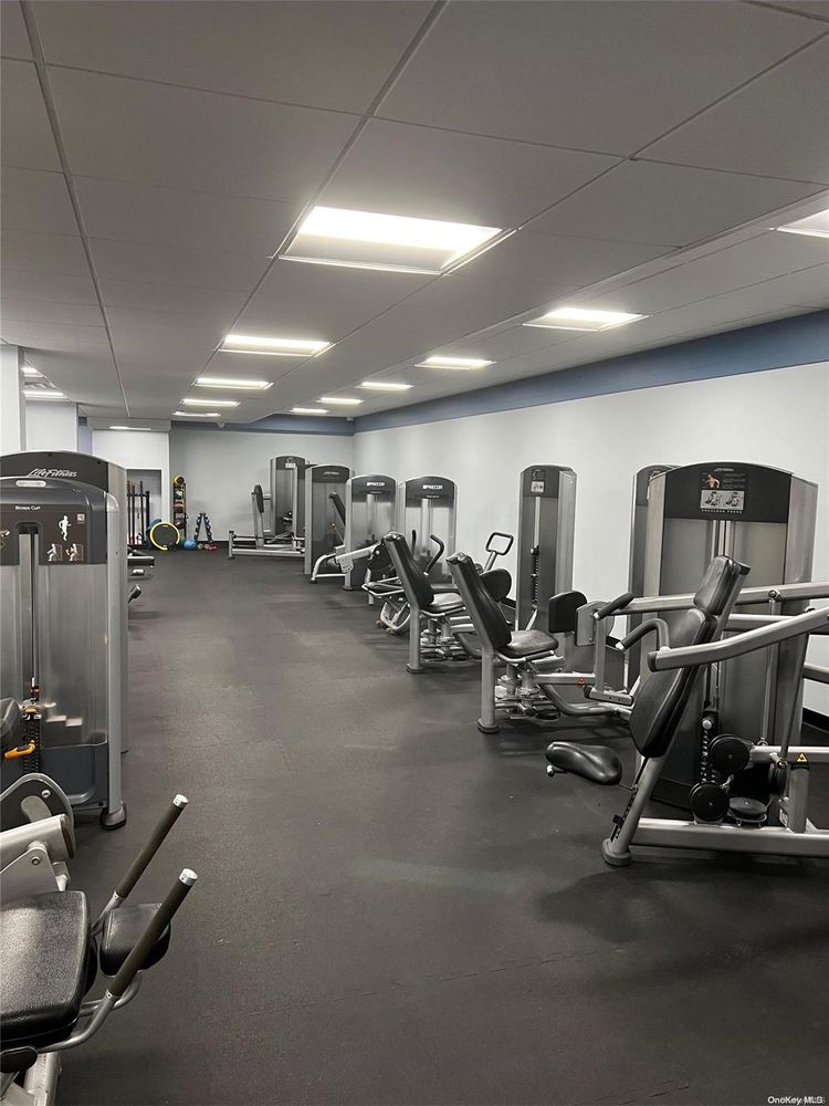2 Bay Club Drive, Unit 8V Queens, NY 11360 - Photo 12 of 17 a view of a room with gym equipment