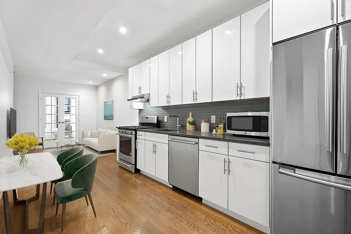 340 14th Street, Unit 2L Brooklyn, NY 11215 - Photo 2 of 9 a kitchen with stainless steel appliances granite countertop a refrigerator sink and white cabinets