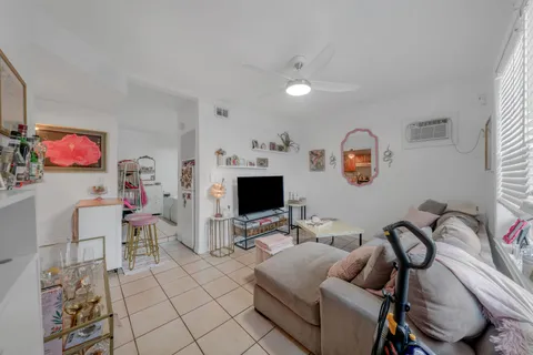 a kitchen with stainless steel appliances cabinets a sink and a refrigerator