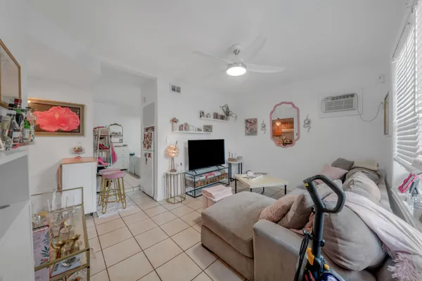 a kitchen with stainless steel appliances cabinets a sink and a refrigerator