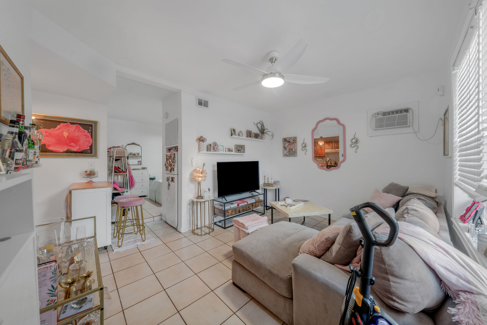 735-745 Meridian Avenue Miami Beach, FL 33139 - Photo 25 of 62 a living room with furniture and a flat screen tv