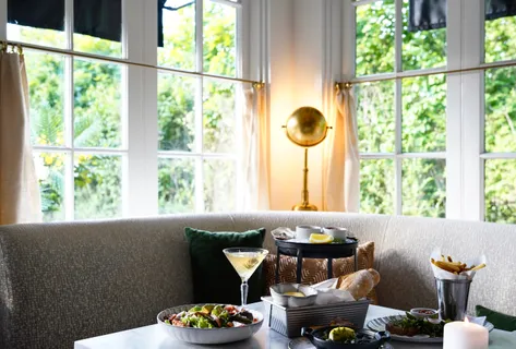 a living room with furniture and a window