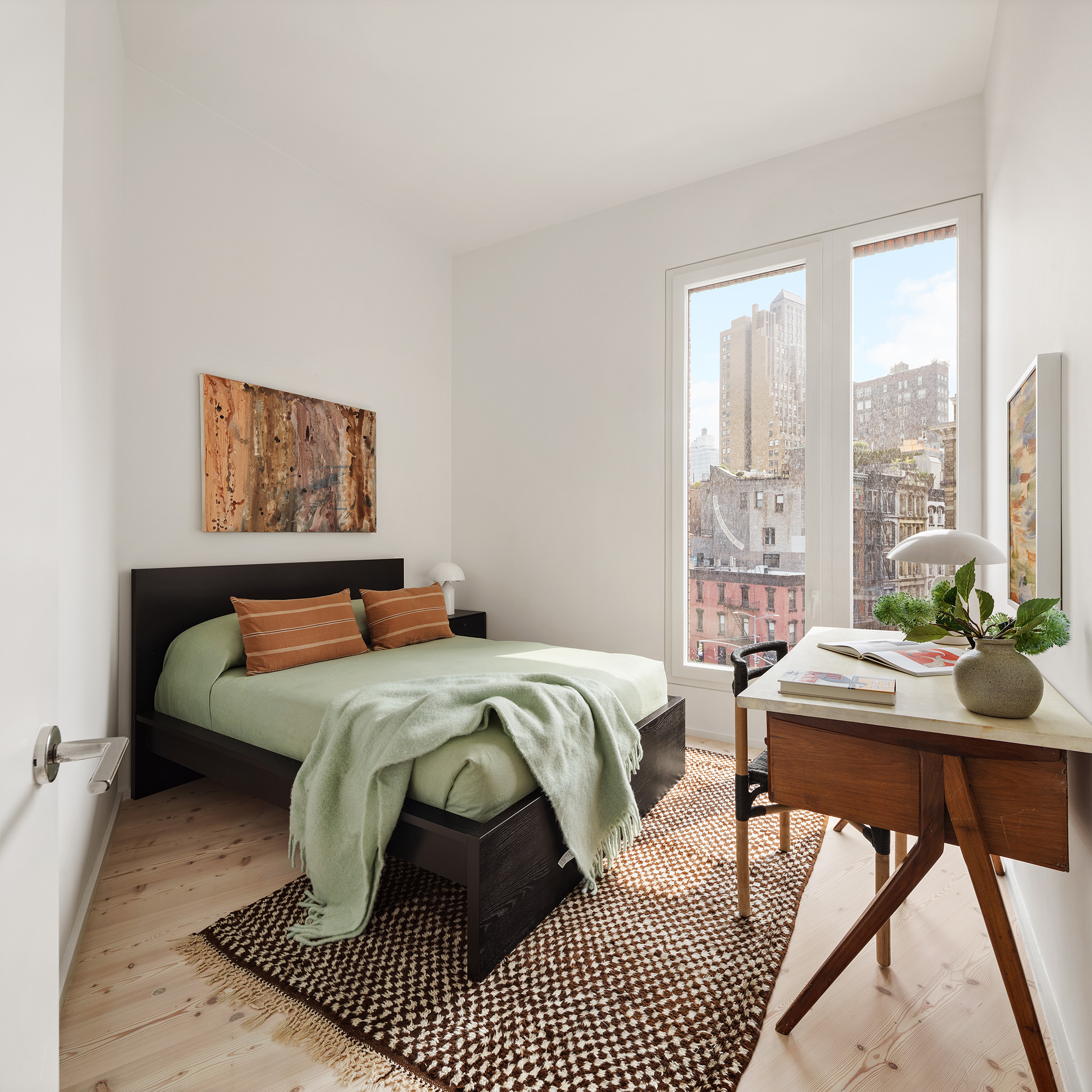 1 Avenue Of The Americas, Unit 5N Manhattan, NY 10013 - Photo 12 of 17 a bedroom with a bed and a table