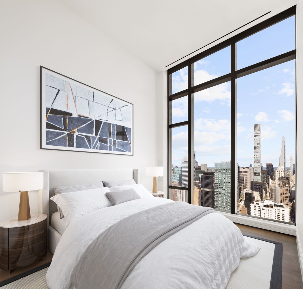 a bathroom with a bathtub and next to a window