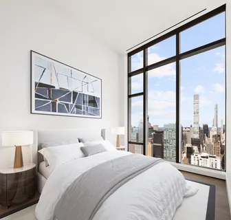 a bathroom with a bathtub and next to a window