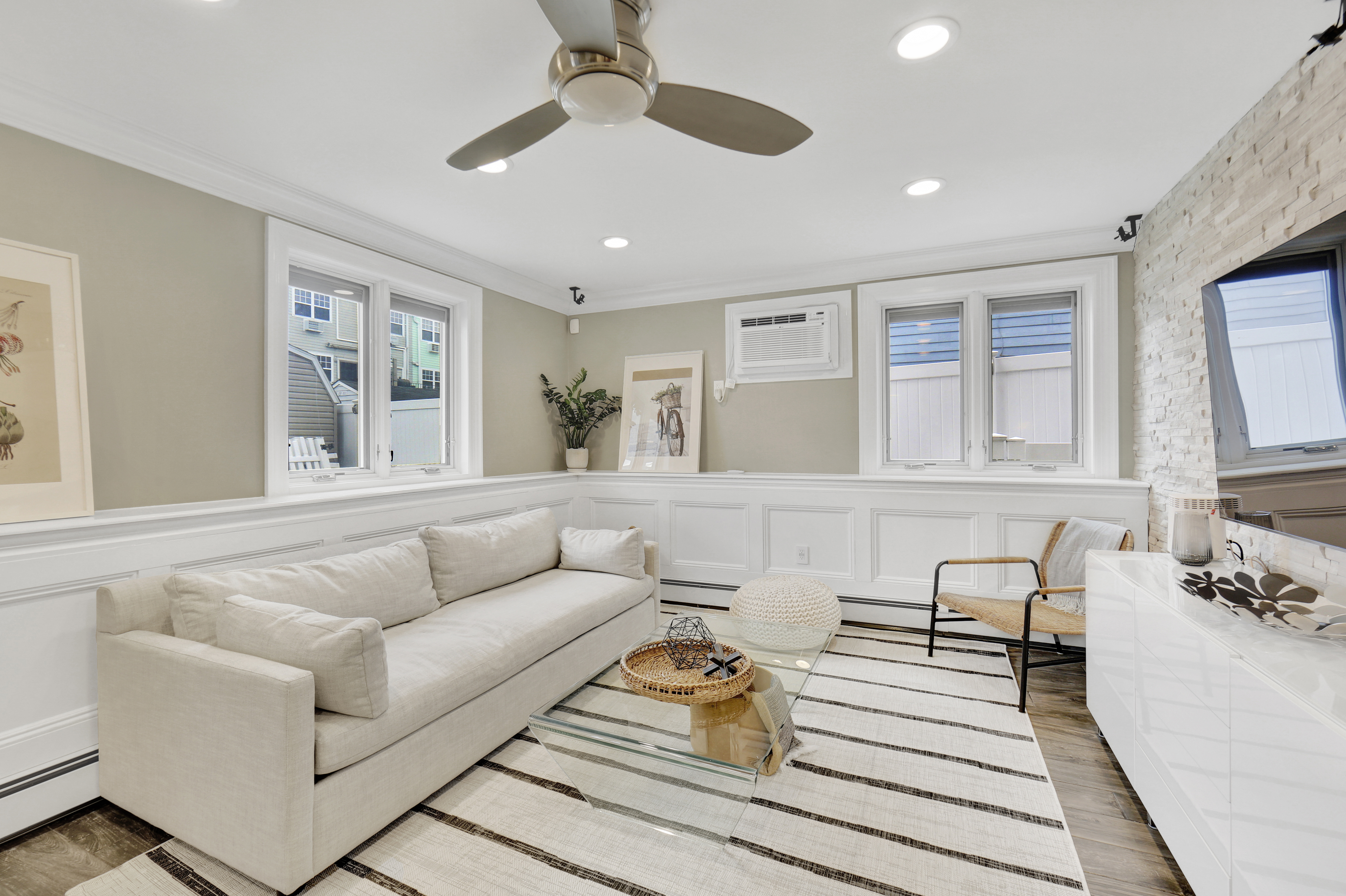 1-69 Beach 98th Street, Unit 1 Queens, NY 11694 - Photo 2 of 23 a living room with furniture and wooden floor