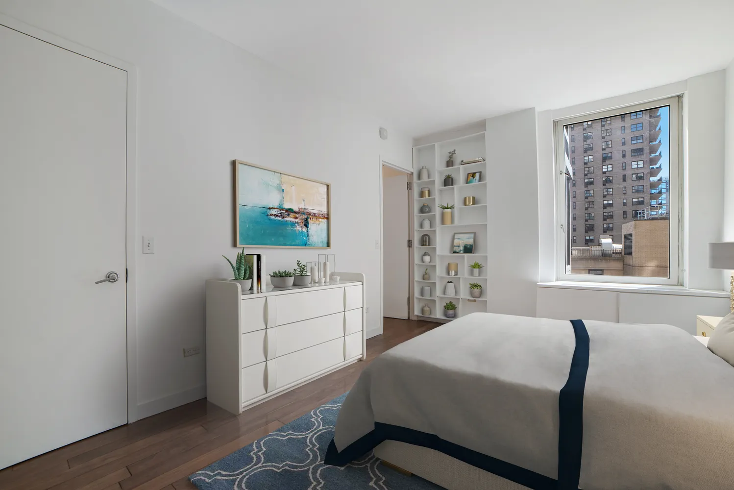 a bedroom with a bed and a window in it