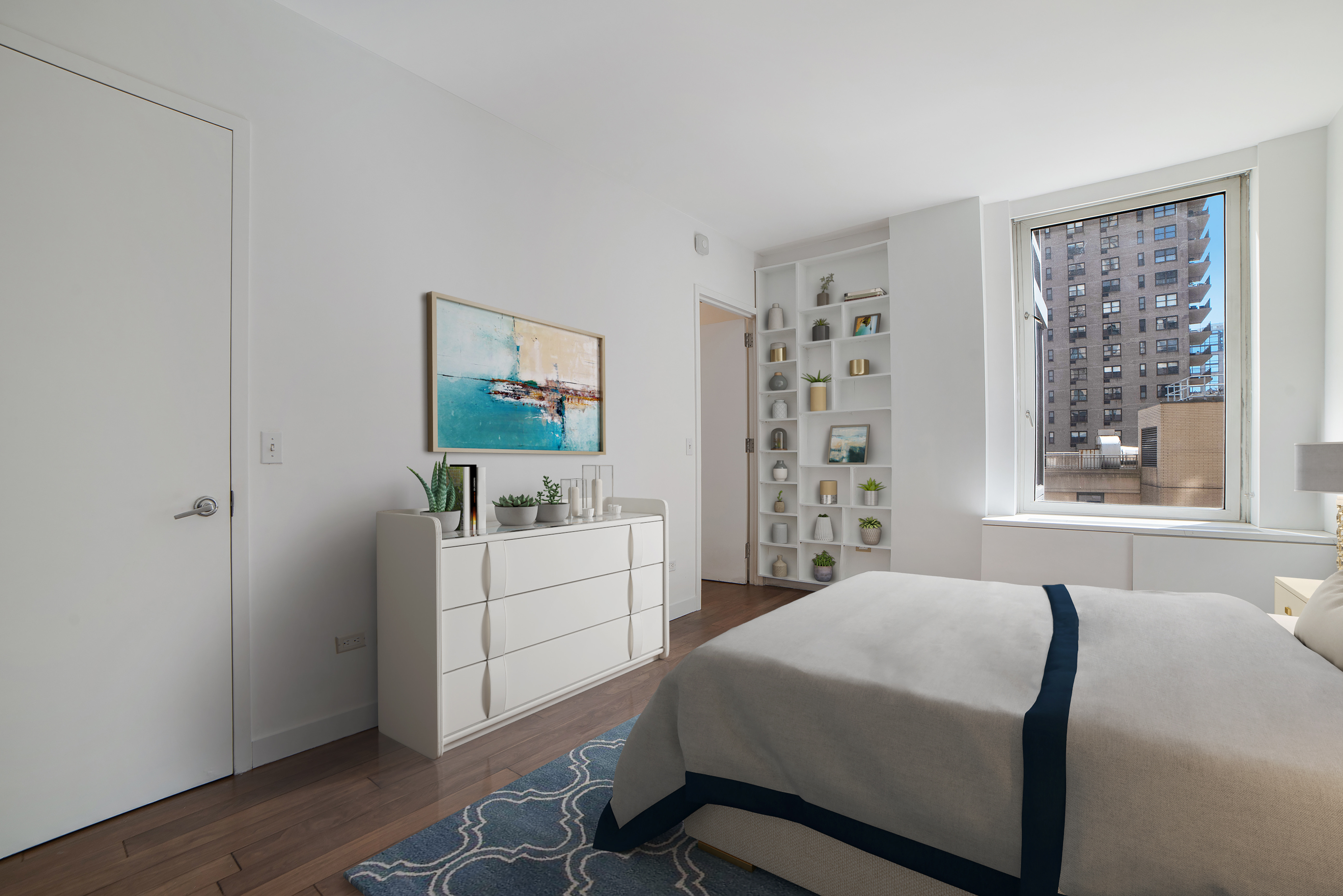 200 Riverside Boulevard, Unit 5EF Manhattan, NY 10069 - Photo 7 of 8 a bedroom with a bed and a window in it