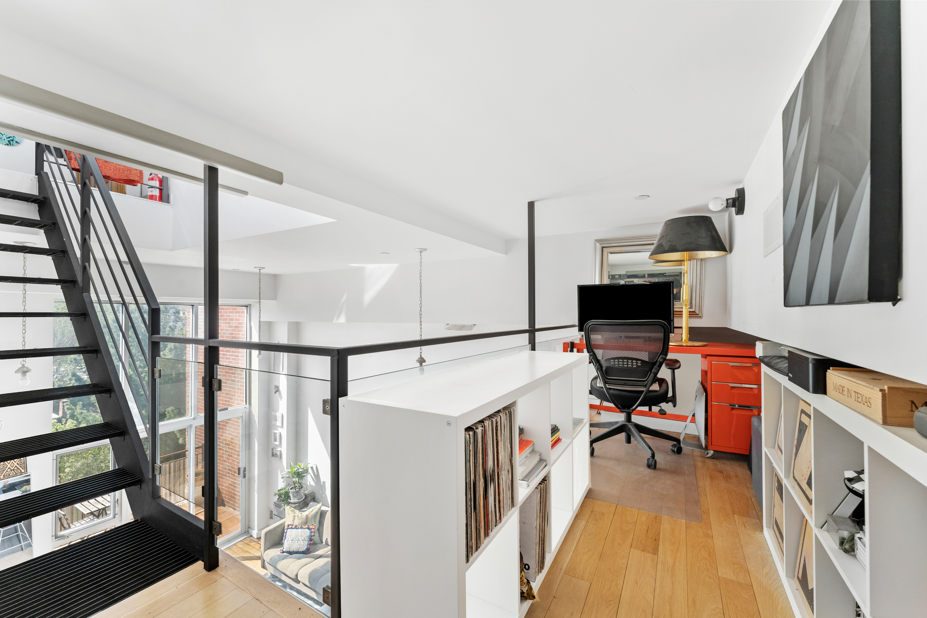 151 Manhattan Avenue, Unit 4B Brooklyn, NY 11206 - Photo 5 of 11 a view of a hallway with workspace and stairs
