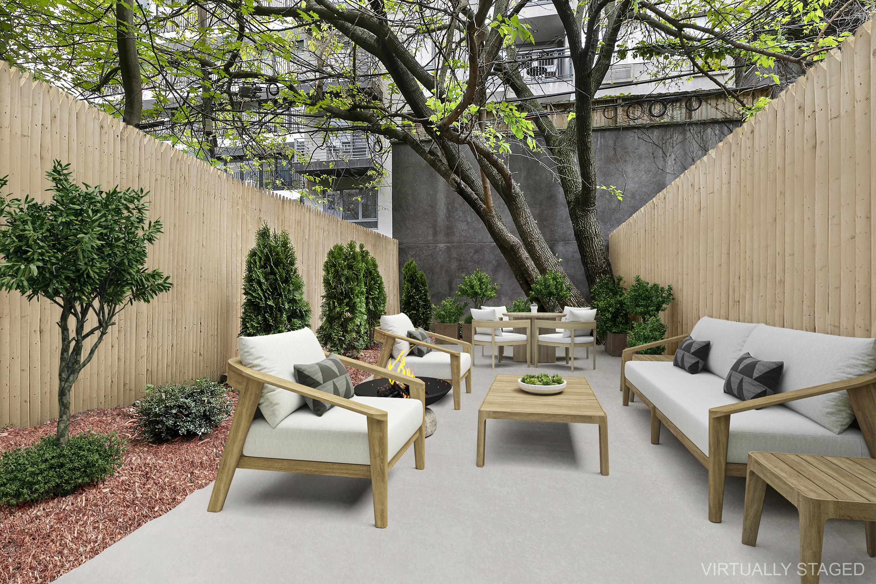 251-253 North 8th Street Brooklyn, NY 11211 - Photo 4 of 11 a view of a patio with couches and a table and chairs with wooden fence and plants
