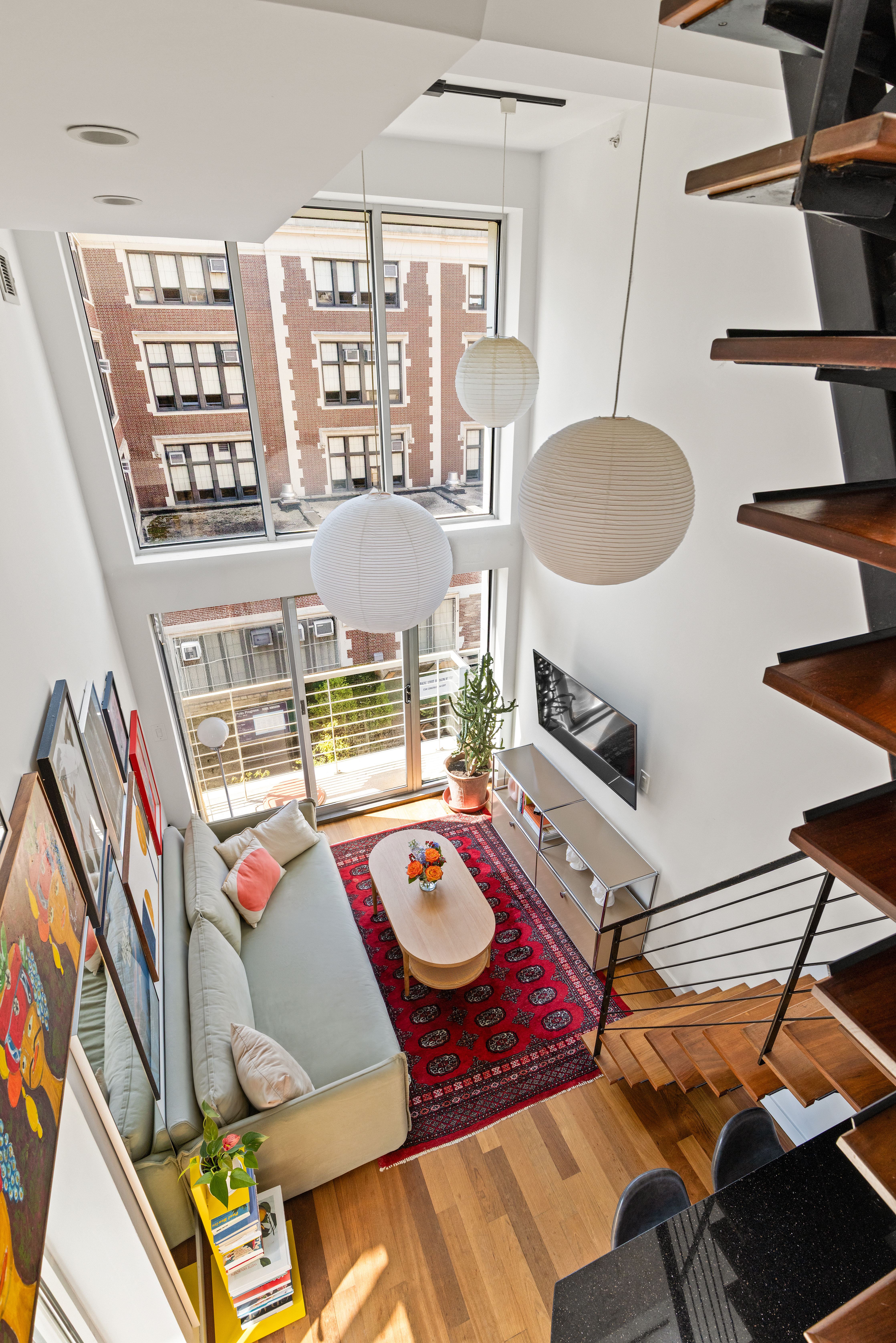335 Warren Street, Unit 401 Brooklyn, NY 11201 - Photo 7 of 15 a living room with furniture and wooden floor