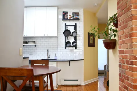 a kitchen with a sink and a refrigerator