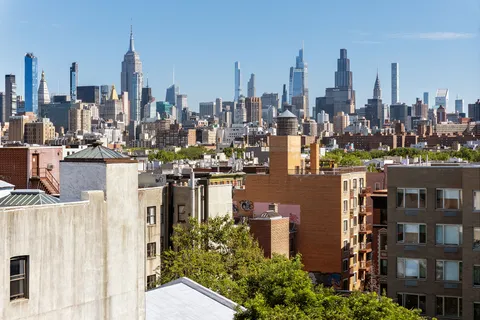 a view of a city with tall buildings