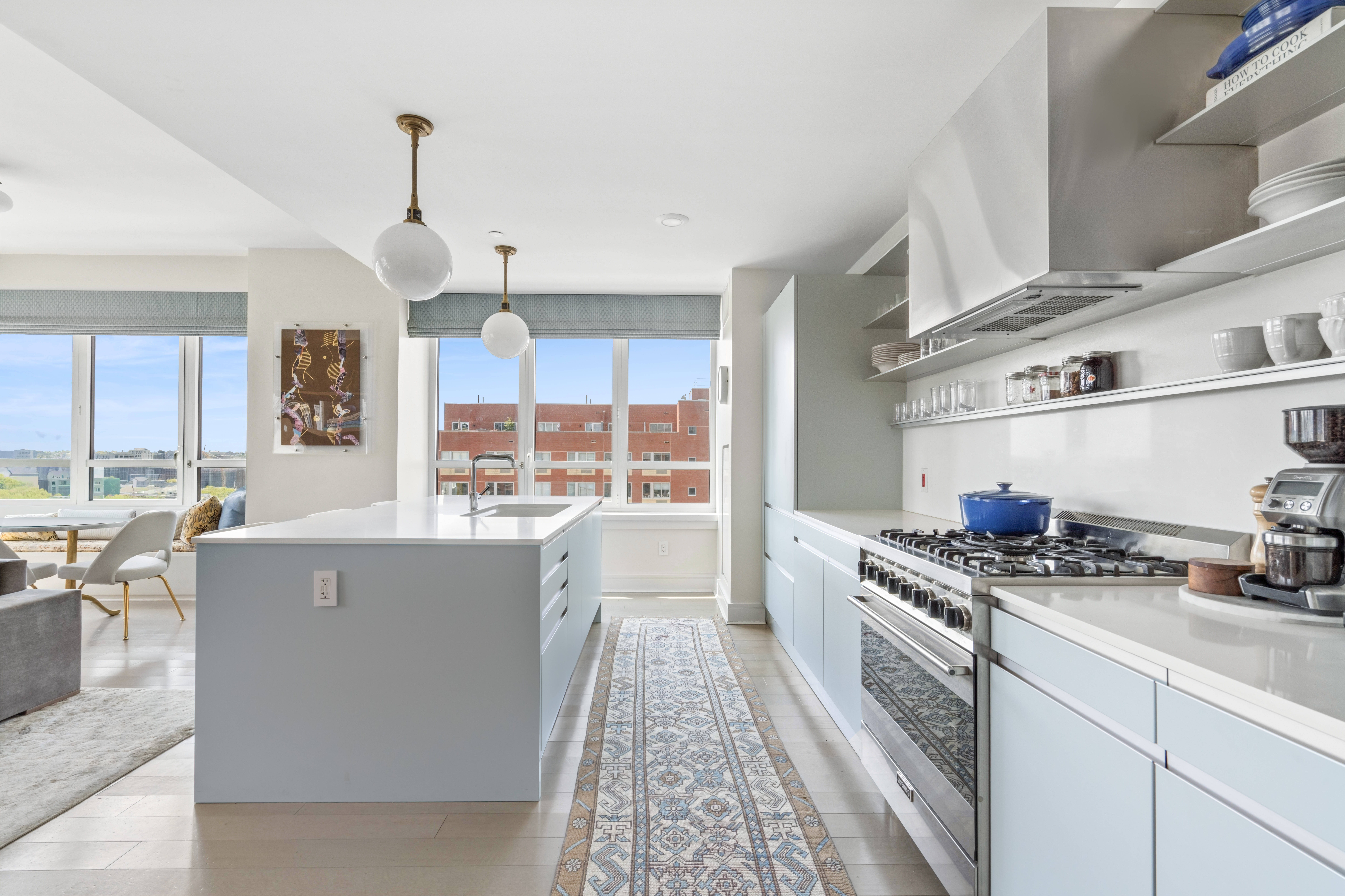 265 State Street, Unit 1201 Brooklyn, NY 11201 - Photo 5 of 19 a kitchen with stainless steel appliances granite countertop a stove and a refrigerator