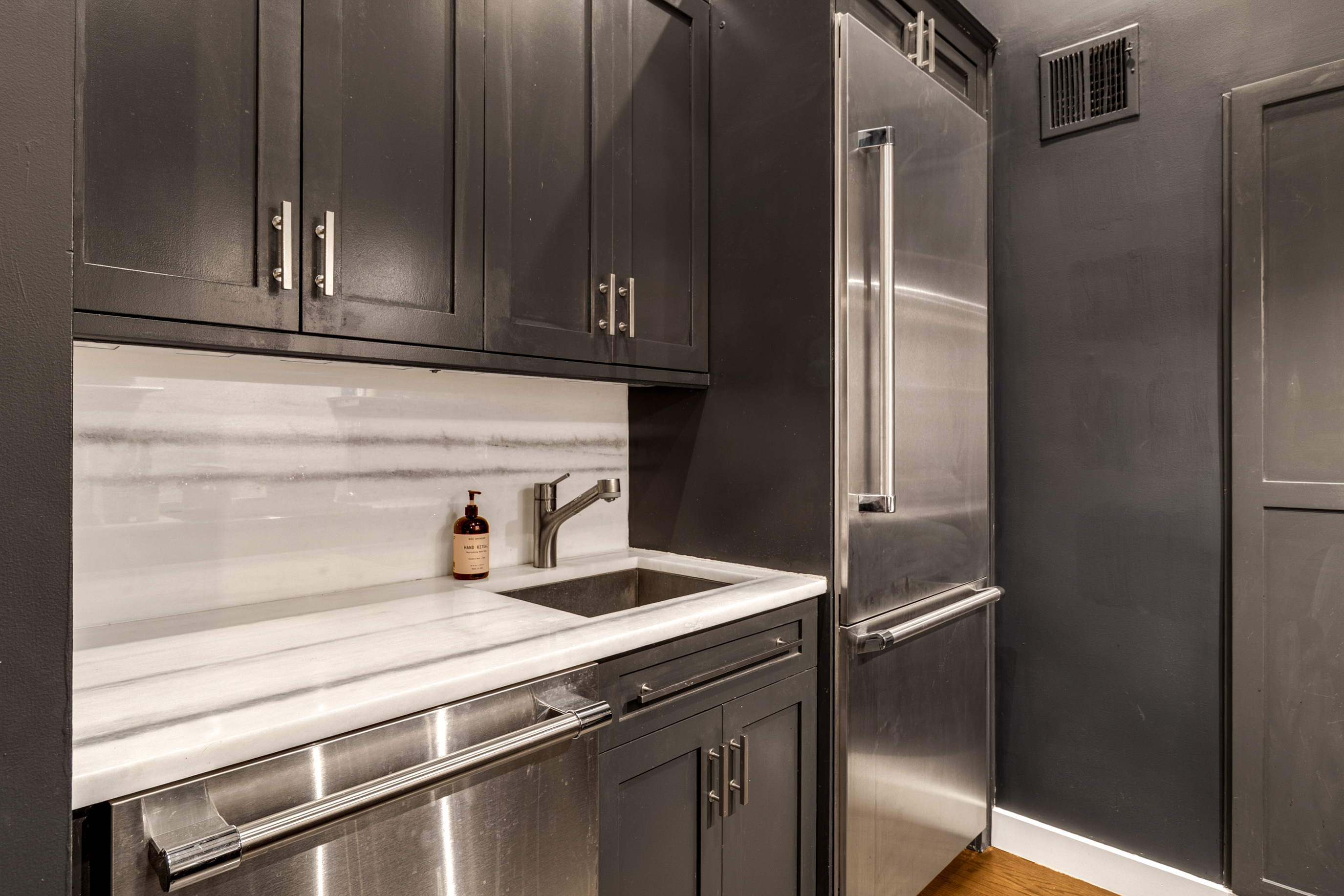 521 West 47th Street, Unit 3A Manhattan, NY 10036 - Photo 10 of 13 a close view of sink and refrigerator