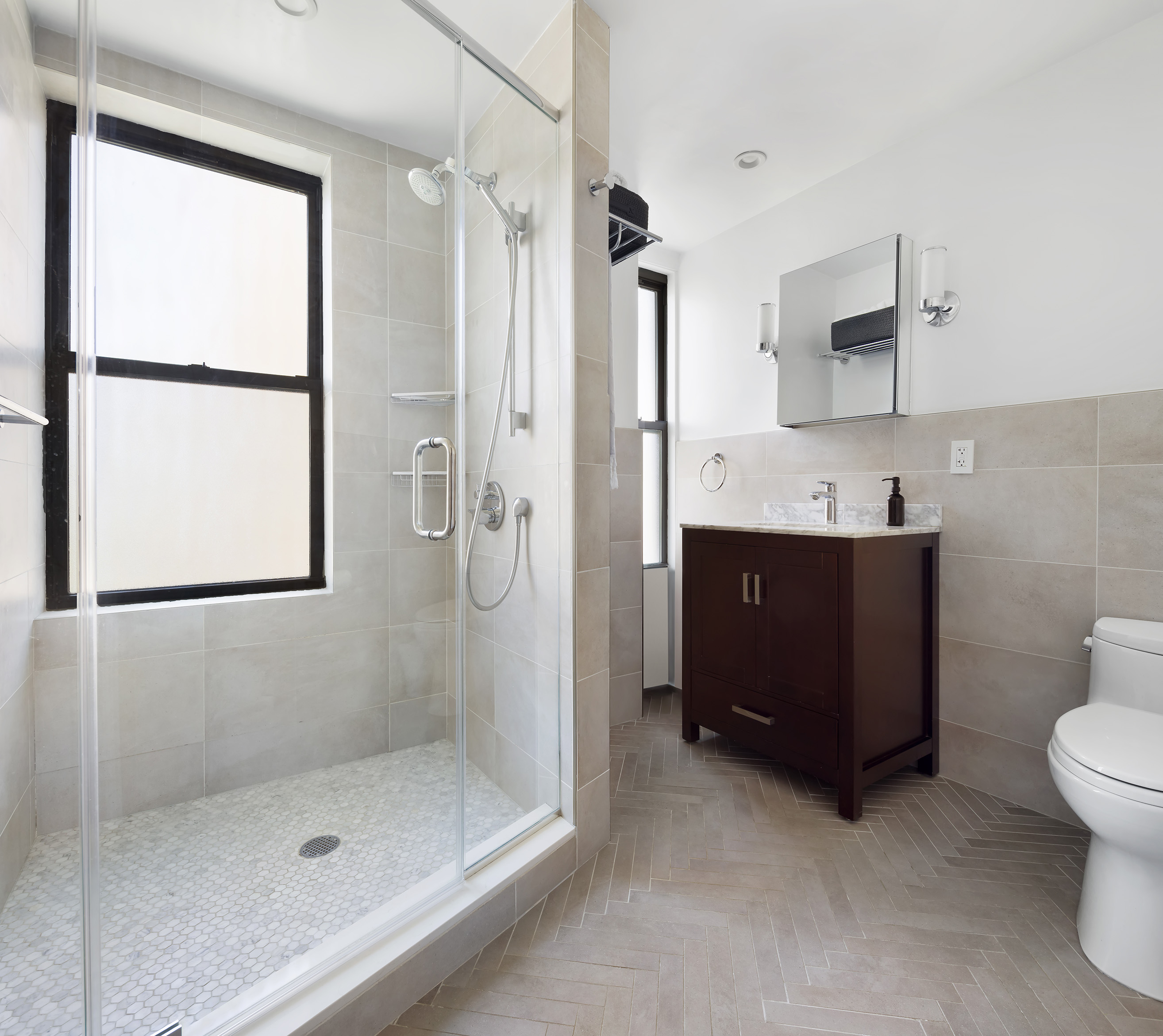 175 West 93rd Street, Unit 10C Manhattan, NY 10025 - Photo 11 of 16 a bathroom with a double vanity sink toilet and shower