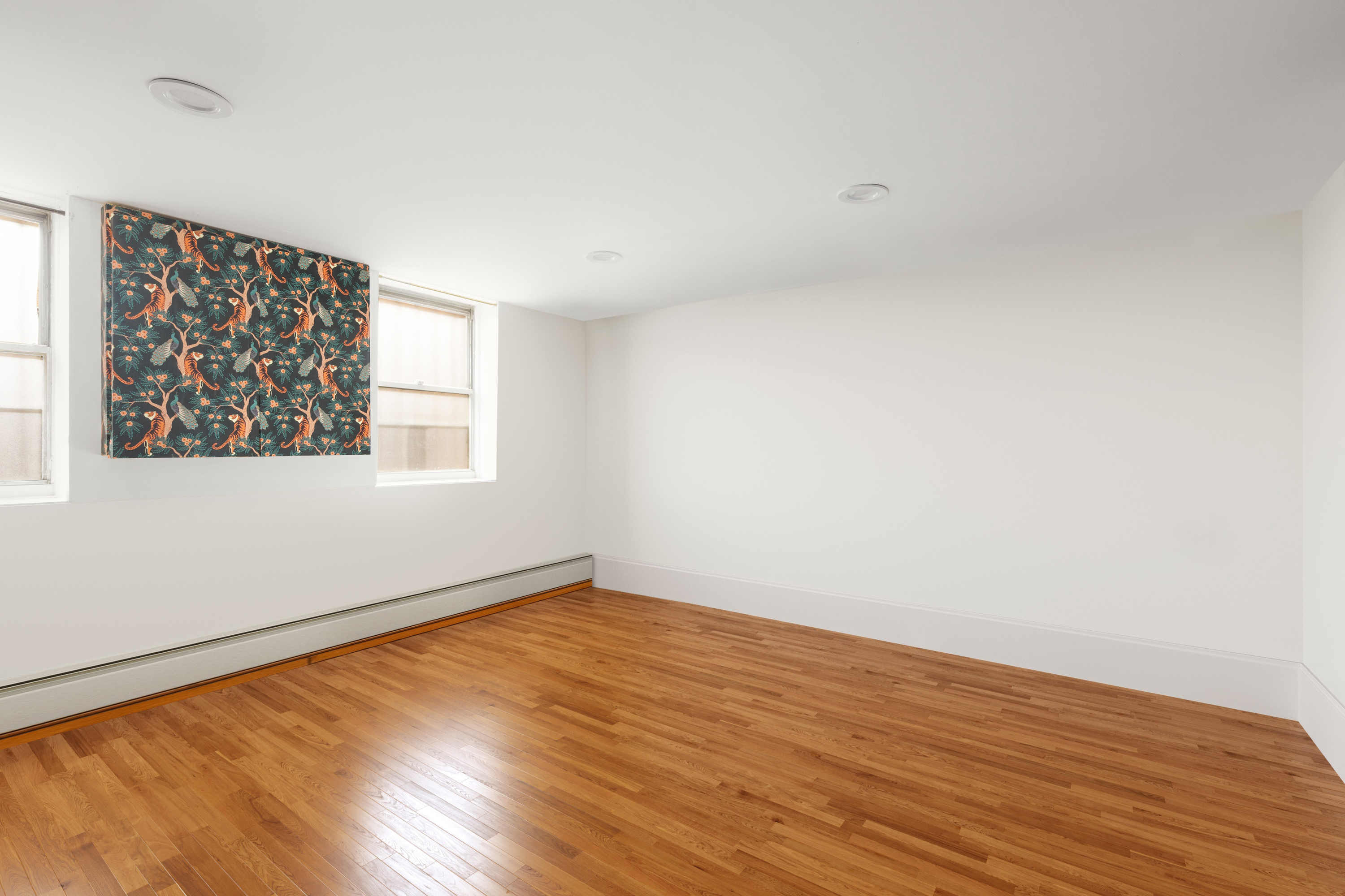 38 Douglass Street Brooklyn, NY 11231 - Photo 9 of 20 an empty room with wooden floor and windows