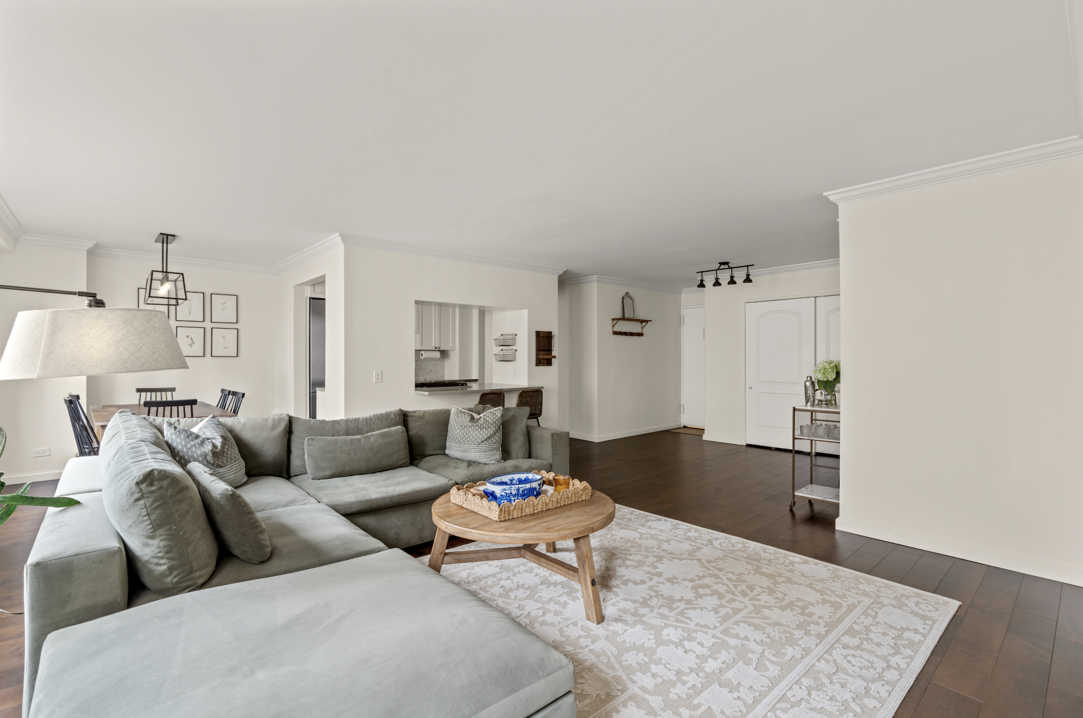 345 East 73rd Street, Unit 11KL Manhattan, NY 10021 - Photo 2 of 12 a living room with furniture and a rug