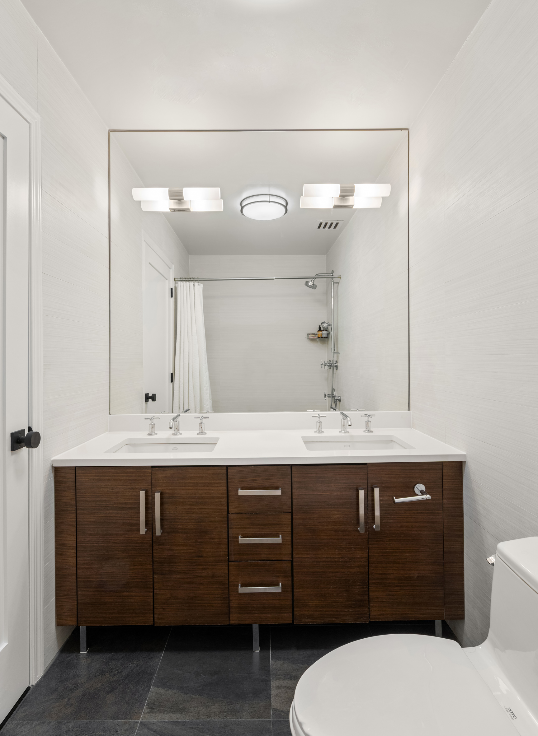 301 West 118th Street, Unit PH1C Manhattan, NY 10026 - Photo 7 of 12 a bathroom with a sink and a mirror