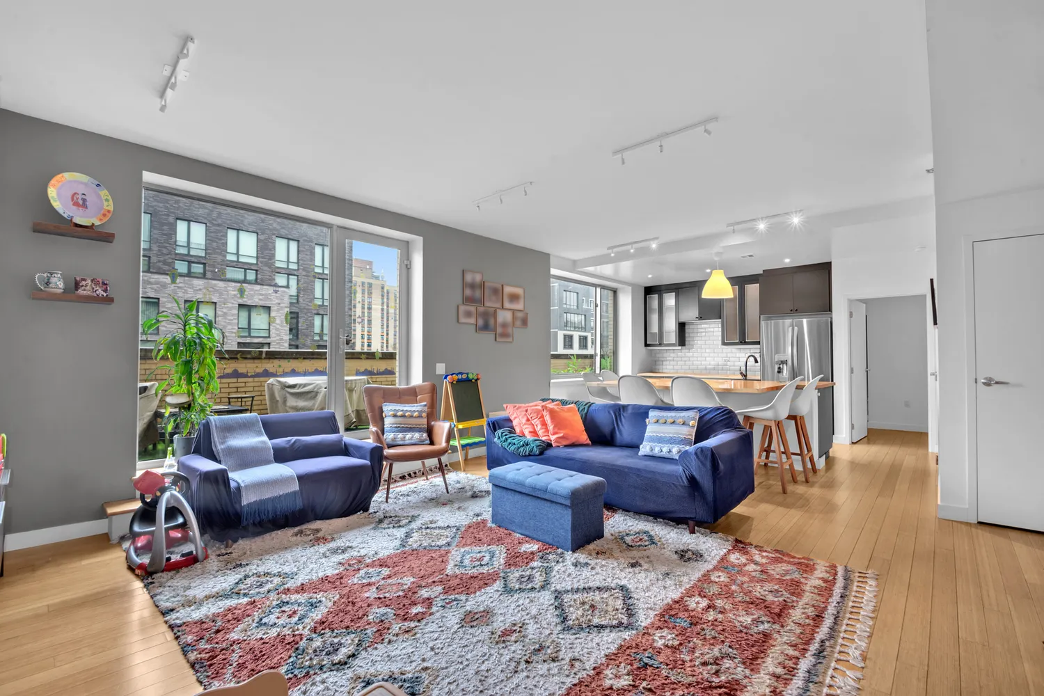 a living room with furniture fireplace and a table