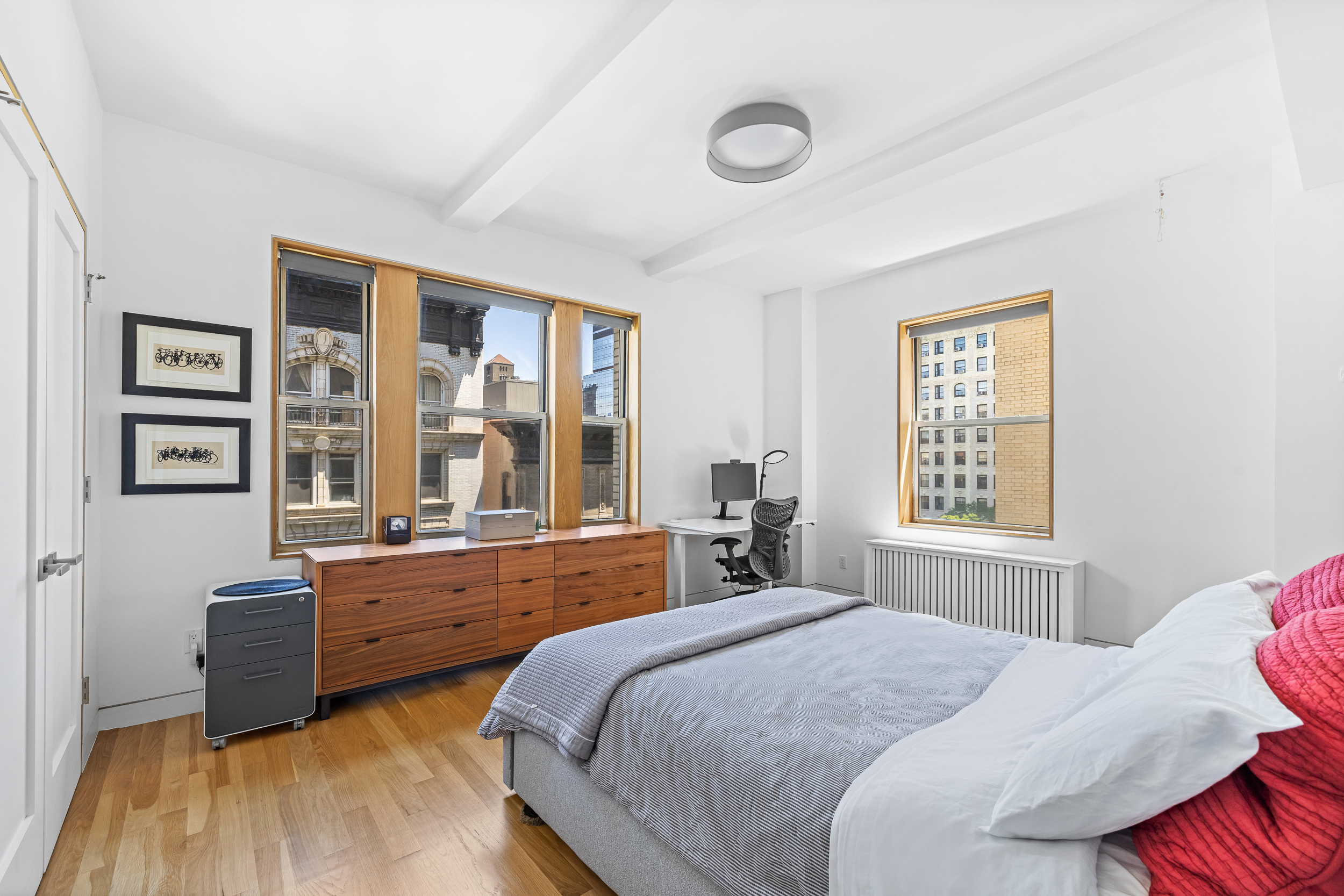 240 West 98th Street, Unit 8D Manhattan, NY 10025 - Photo 6 of 12 a bedroom with a bed and windows
