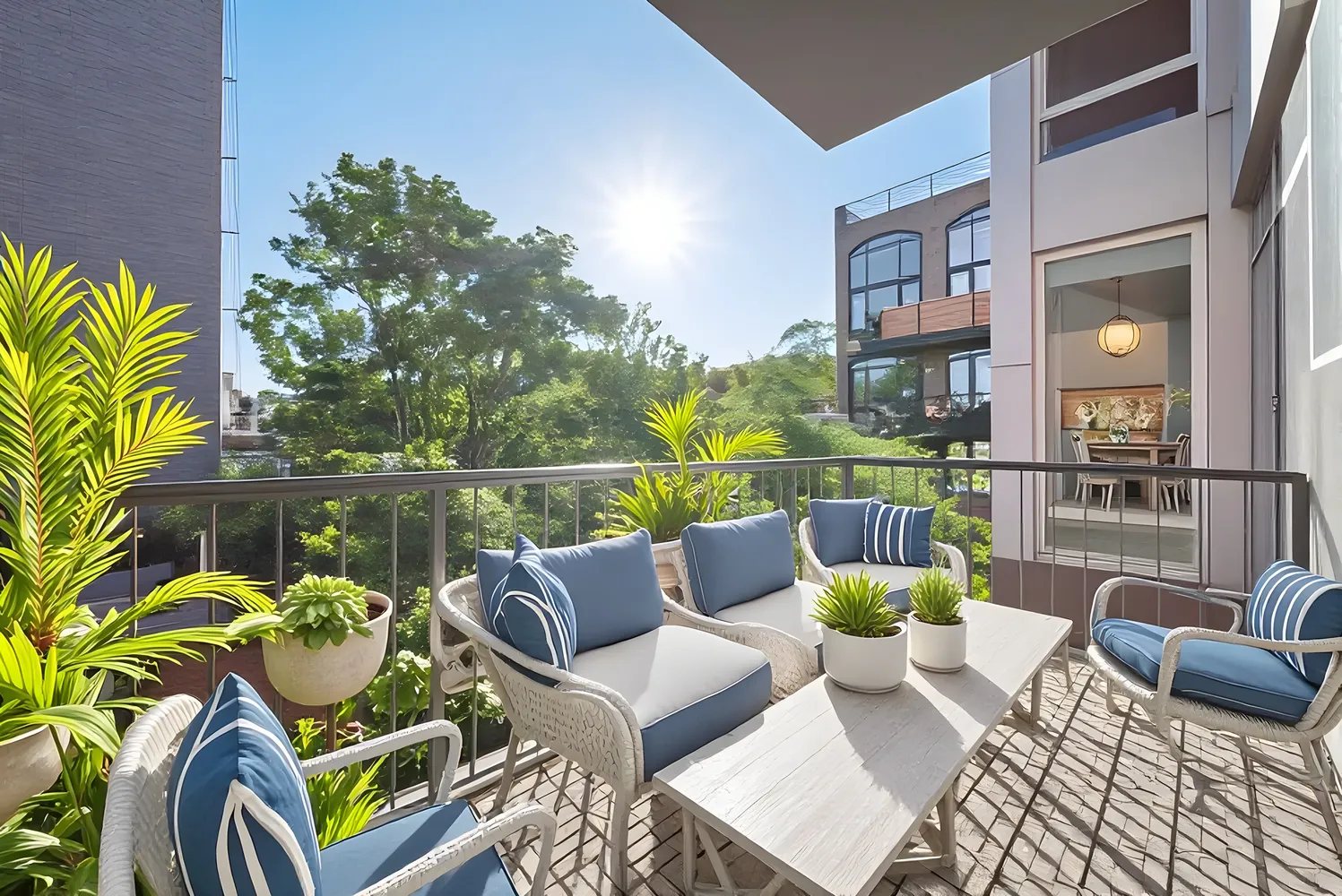 a balcony with furniture and a potted plant