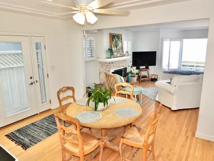 a kitchen with granite countertop a sink stainless steel appliances and cabinets