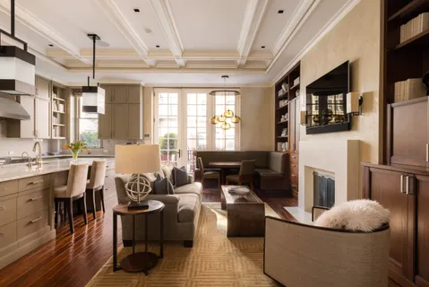 a living room with furniture fireplace and flat screen tv