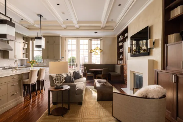 a living room with furniture fireplace and flat screen tv
