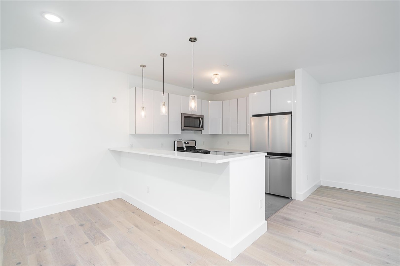 8621 River Road, Unit 6D North Bergen, NJ 07047 - Photo 5 of 36 a view of a kitchen with stainless steel appliances refrigerator stove and wooden floor