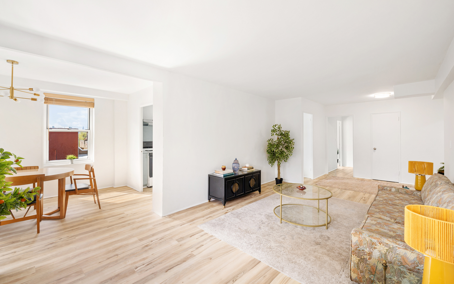 35-50 85th Street, Unit 9E Queens, NY 11372 - Photo 4 of 13 a living room with furniture and wooden floor