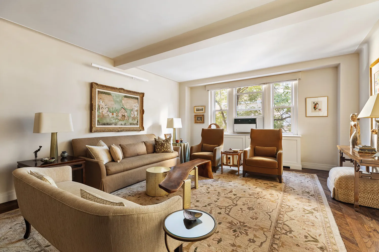 a living room with furniture and a floor to ceiling window