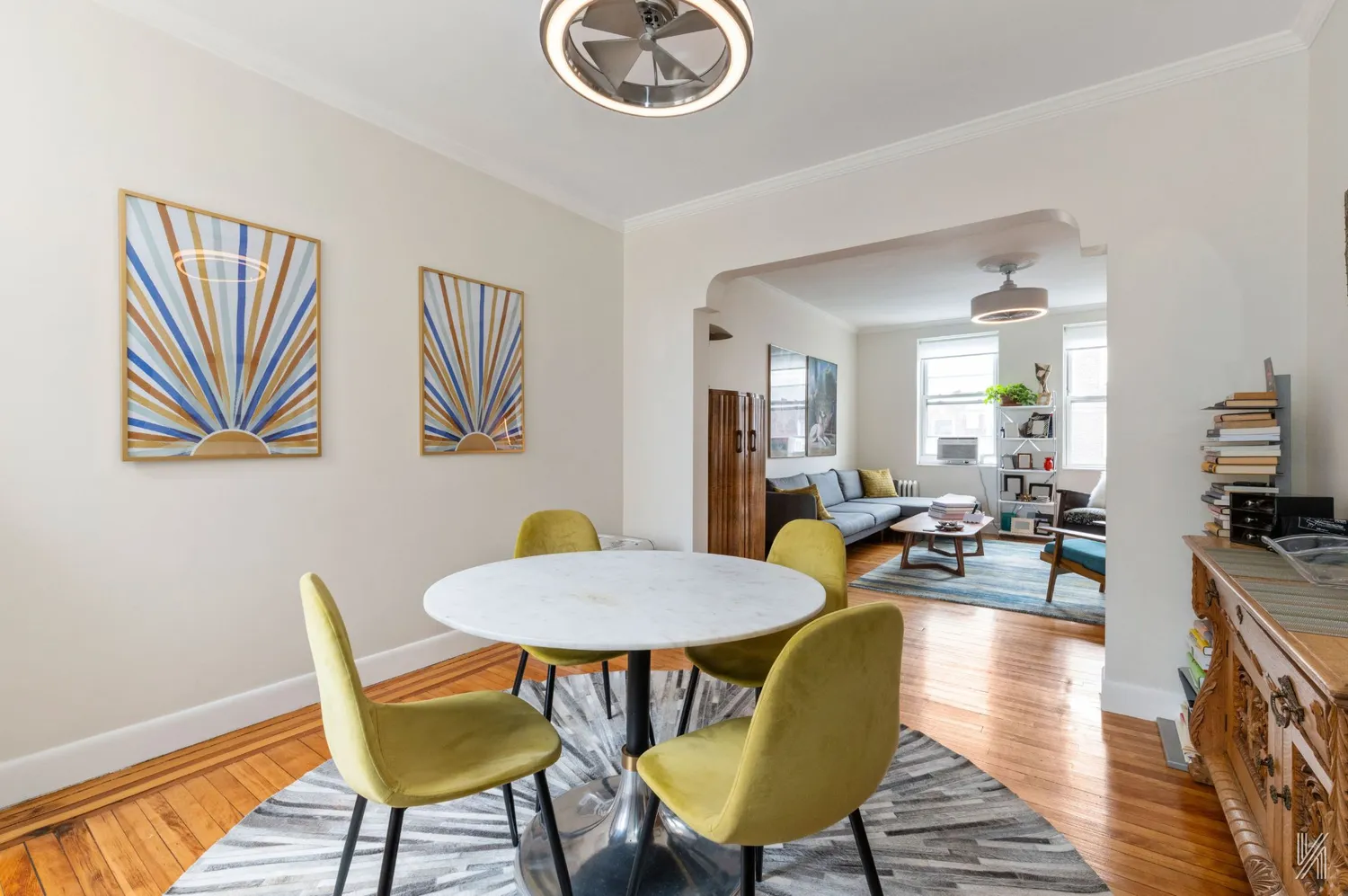 a view of a dining room with furniture and wooden floor