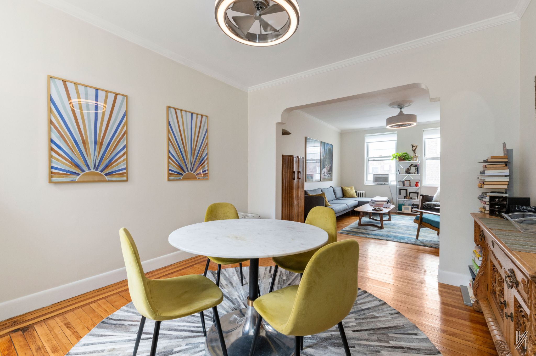 34-39 82nd Street, Unit 52 Queens, NY 11372 - Photo 3 of 18 a view of a dining room with furniture and wooden floor