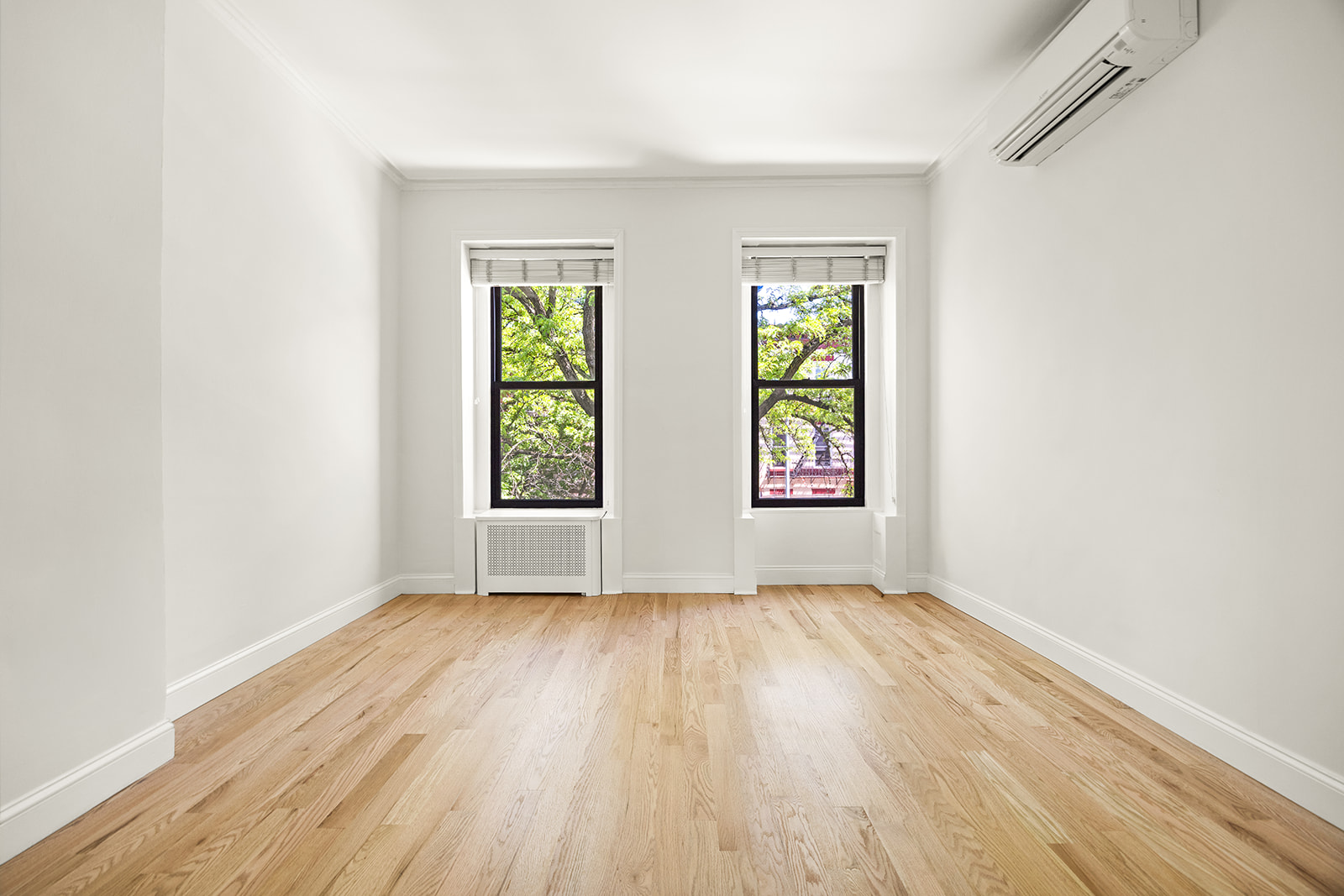 616 Carroll Street, Unit 2 Brooklyn, NY 11215 - Photo 10 of 15 an empty room with wooden floor and windows
