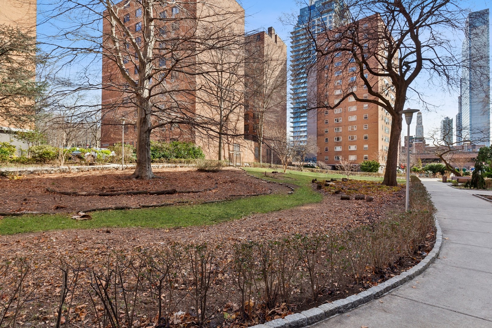 105 Ashland Place, Unit 10E Brooklyn, NY 11201 - Photo 6 of 7 a view of a street with a building and trees in the background