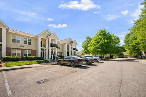 a view of street with parked cars