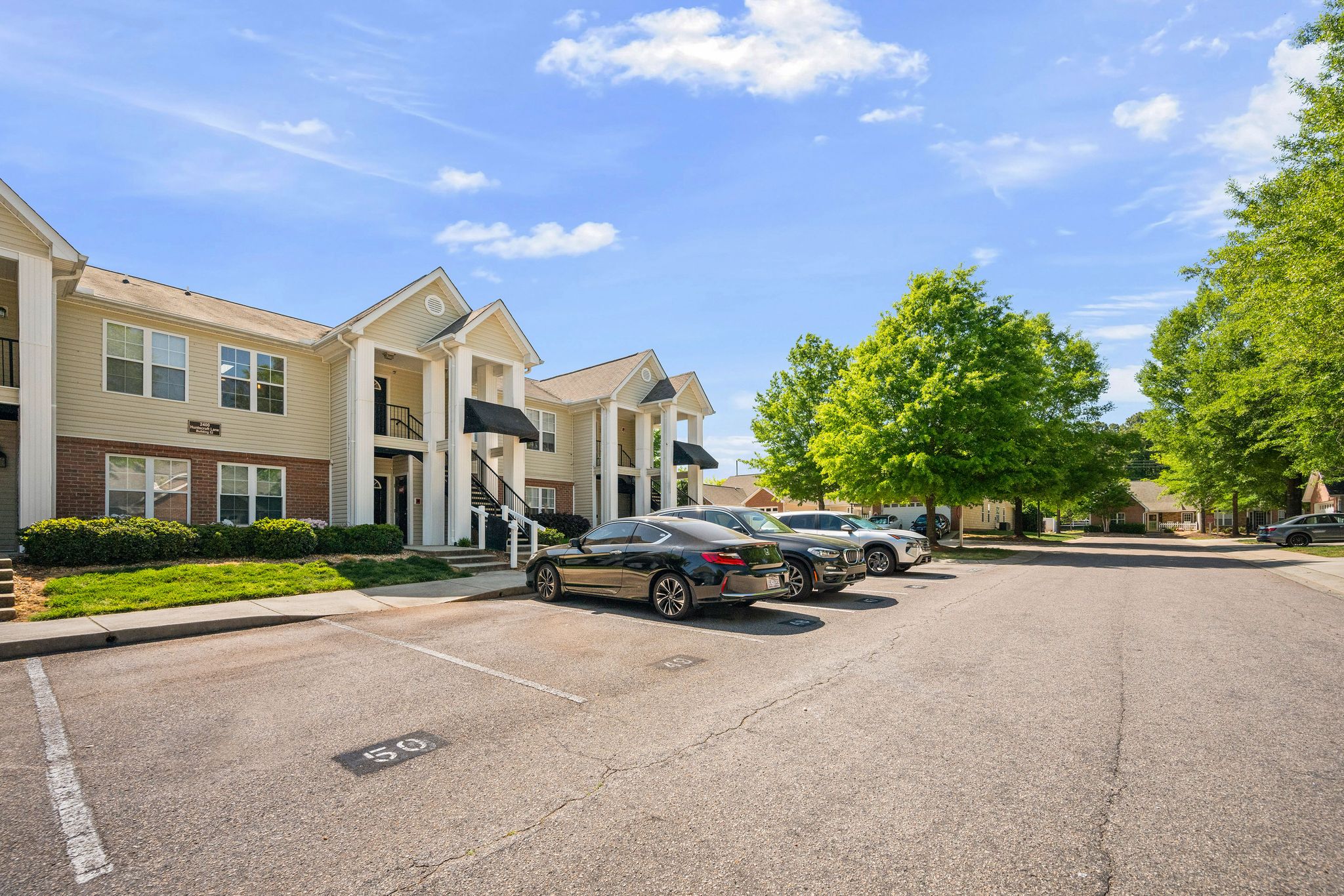 Huntscroft Lane Raleigh, NC 27617 - Photo 5 of 49 a view of street with parked cars