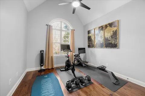 a view of a dining room with furniture kitchen and wooden floor