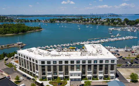 an aerial view of a house with a lake view